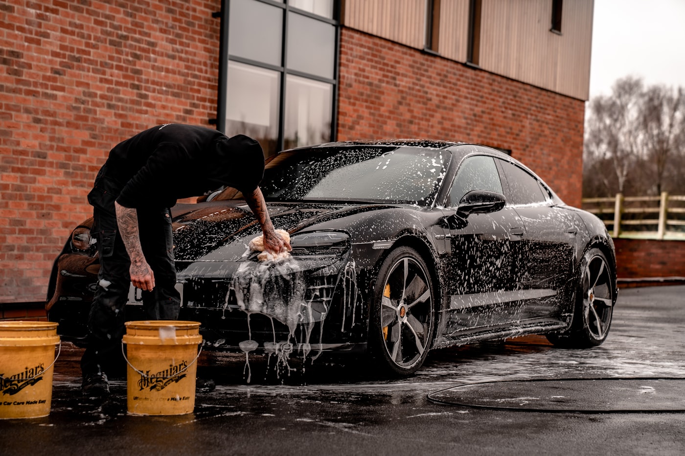 Hand washing a car at Tee Time Auto Spa